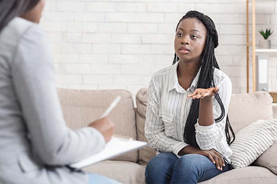 Women receiving counseling in person to help quit smoking.